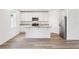 Modern kitchen featuring white cabinets, granite countertops, and stainless steel appliances at 2925 Wild Olive Dr, St Cloud, FL 34772
