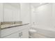 Well-lit bathroom features a granite countertop and a shower-tub combo at 2929 Wild Olive Dr, St Cloud, FL 34772