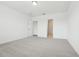 Expansive bedroom with plush carpet, en-suite access, and bright natural lighting at 2929 Wild Olive Dr, St Cloud, FL 34772