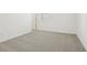 Bedroom with neutral carpet, white walls, baseboards, electrical outlets, and window with blinds at 2929 Wild Olive Dr, St Cloud, FL 34772