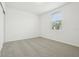 This bedroom features neutral carpet and a window that provides natural light at 2929 Wild Olive Dr, St Cloud, FL 34772