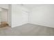A neutral-carpeted room with a closet at 2929 Wild Olive Dr, St Cloud, FL 34772