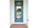 Inviting front door with glass panel, offering a glimpse of the home's interior and modern design at 2929 Wild Olive Dr, St Cloud, FL 34772