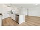 Modern kitchen featuring stainless steel appliances, island with sink and granite countertops at 2929 Wild Olive Dr, St Cloud, FL 34772