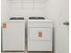 The laundry room includes a white washer and dryer at 2929 Wild Olive Dr, St Cloud, FL 34772