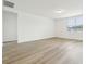 Spacious living room featuring sleek flooring, bright white walls, and ample natural light at 2929 Wild Olive Dr, St Cloud, FL 34772
