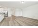 Bright living space boasts modern flooring, neutral walls, and seamless transition into the kitchen at 2929 Wild Olive Dr, St Cloud, FL 34772