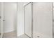 Bright bathroom shower features glass door, white subway tile, and white tiled floor with drain at 2929 Wild Olive Dr, St Cloud, FL 34772