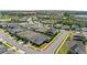 A picturesque aerial perspective of a residential neighborhood showcasing the rooftops and street layout at 3347 Hanging Tide St, Winter Garden, FL 34787