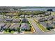 Beautiful aerial view of a residential neighborhood near a lake in a sunny environment at 3347 Hanging Tide St, Winter Garden, FL 34787