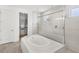 Bathroom with a bathtub and a stand up shower at 3347 Hanging Tide St, Winter Garden, FL 34787