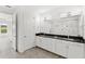Bathroom featuring double sinks, granite countertop, and an open design that gives this space a modern feel at 3347 Hanging Tide St, Winter Garden, FL 34787
