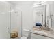 Bathroom featuring glass-enclosed shower, single vanity, and modern fixtures at 3347 Hanging Tide St, Winter Garden, FL 34787