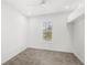 Bright bedroom featuring a ceiling fan, tile floors and a window with natural light at 3347 Hanging Tide St, Winter Garden, FL 34787