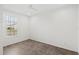 Bright bedroom featuring a ceiling fan, tile floors and a window with natural light at 3347 Hanging Tide St, Winter Garden, FL 34787