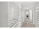 A spacious walk-in closet with custom shelving and drawers for organization at 3347 Hanging Tide St, Winter Garden, FL 34787