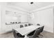 Contemporary dining room featuring a modern light fixture, white walls, tile floor and seating for six at 3347 Hanging Tide St, Winter Garden, FL 34787