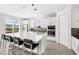 Spacious kitchen featuring stainless steel appliances, kitchen island with bar stool seating, and pendant lighting at 3347 Hanging Tide St, Winter Garden, FL 34787