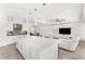 Open concept living room with modern lighting, large island, and a view to the living space at 3347 Hanging Tide St, Winter Garden, FL 34787