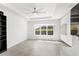 Open living area with modern lighting, neutral colors, and large windows at 3347 Hanging Tide St, Winter Garden, FL 34787