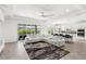 Bright living room that connects to a kitchen space with an access to the patio at 3347 Hanging Tide St, Winter Garden, FL 34787