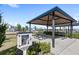 Outdoor covered picnic area with seating next to the playground at 3347 Hanging Tide St, Winter Garden, FL 34787