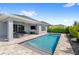 Backyard swimming pool with patio and outdoor seating, perfect for relaxation at 3347 Hanging Tide St, Winter Garden, FL 34787
