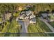 Expansive property with lush landscaping, long driveway, and mature trees in a serene neighborhood at 4205 Clarice Ct, Windermere, FL 34786