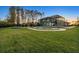Expansive backyard with a screened-in pool, trampoline, and custom-designed landscaping at 4205 Clarice Ct, Windermere, FL 34786