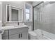 Stylish bathroom with a modern vanity, illuminated mirror, and a sleek glass-enclosed shower at 4205 Clarice Ct, Windermere, FL 34786