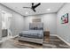 Stylish bedroom with a tufted headboard, hardwood floors, and a ceiling fan at 4205 Clarice Ct, Windermere, FL 34786