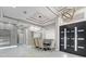 Elegant foyer with open dining area, modern lighting, and stylish double doors, complemented by marble flooring at 4205 Clarice Ct, Windermere, FL 34786