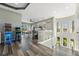 An expansive game room features an arcade, a ping pong table, and modern kitchen with bar stool seating at 4205 Clarice Ct, Windermere, FL 34786