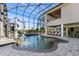 Amazing indoor pool area with a slide, water feature, and clear skylight at 4205 Clarice Ct, Windermere, FL 34786