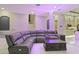 Spacious living room featuring a large sectional, accent lighting, and access to the kitchen at 4205 Clarice Ct, Windermere, FL 34786