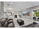 Expansive living room with a view of the kitchen, showcasing an open-concept design and entertainment center at 4205 Clarice Ct, Windermere, FL 34786