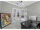 Bright office with double glass doors, light-colored floors, and an eye-catching Marilyn Monroe portrait at 4205 Clarice Ct, Windermere, FL 34786
