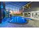 Enclosed pool area featuring custom pool and slide at dusk at 4205 Clarice Ct, Windermere, FL 34786