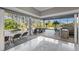 Inviting pool area with a waterfall, lounging chairs, and an outdoor bar area at 4205 Clarice Ct, Windermere, FL 34786