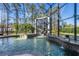 Enclosed pool area featuring a custom waterfall feature and spa at 4205 Clarice Ct, Windermere, FL 34786
