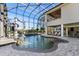 Impressive indoor pool area featuring a water slide, lounging space, and high ceilings with lots of natural light at 4205 Clarice Ct, Windermere, FL 34786