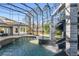 Enclosed pool area featuring a custom slide and waterfall feature at 4205 Clarice Ct, Windermere, FL 34786
