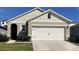 Charming single-Gathering home with a two-car garage, well-maintained lawn and manicured shrubbery at 4633 Barberry Ave, Lakeland, FL 33811
