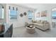Bonus room features a comfortable seating area with views from the bright window in a neutral color palette at 5602 Stockade Blvd, St Cloud, FL 34771