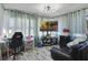 Versatile bonus room featuring a cozy seating area, work space, and ample natural light at 5719 Meridian Way, Orlando, FL 32808