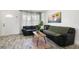 Cozy living room with a large sectional sofa, area rug, and decorative wall art at 5719 Meridian Way, Orlando, FL 32808