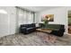 Inviting living room featuring a comfortable sectional sofa, stylish rug, and bright natural light at 5719 Meridian Way, Orlando, FL 32808