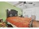Bright bedroom with a large bed, two chairs, and a window with natural light at 5719 Meridian Way, Orlando, FL 32808