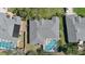 Aerial shot of the home showing roof, screened in pool, large yard, and the surrounding neighborhood at 5776 Falling Tree Ln, Port Orange, FL 32127