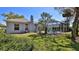 The home has a spacious backyard with well-maintained lawn and screened-in lanai; a perfect spot for relaxing at 5776 Falling Tree Ln, Port Orange, FL 32127
